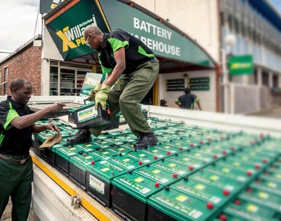 Battery Warehouse workers offloading batteries